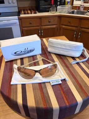 Oakley Wrap Sunglasses with Brown Lenses and Gold Frame